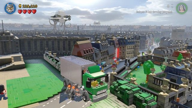 Po zebraniu monet z kolejnej części miasta podejdź do blokującego drogę TIRa i zniszcz go używając pancerza wspomaganego od Batmana Po dojściu do łuku triumfalnego zmierz się ze sługusami Brainiaca - Eurokłopoty | Opis przejścia Lego Batman 3 Poza Gotham - LEGO Batman 3: Poza Gotham - poradnik do gry