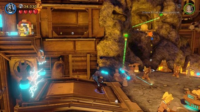 Po przejściu przez maszynę ubierz się w kostium z czujnikami i wejdź na górę używając haku - Qwardy Orzech Do Zgryzienia | Opis przejścia Lego Batman 3 Poza Gotham - LEGO Batman 3: Poza Gotham - poradnik do gry