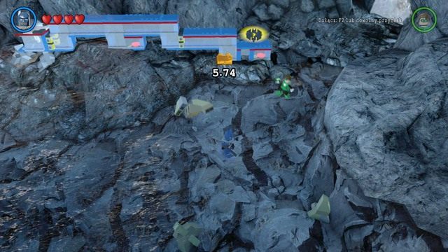 Złoty klocek możesz znaleźć obok mechanizmu dla Atoma, w którym odblokujesz swoją postać - Złote Klocki | Batjaskinia - sekrety w Lego Batman 3 Poza Gotham - LEGO Batman 3: Poza Gotham - poradnik do gry