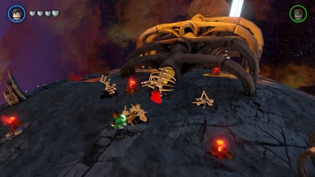 Zniszcz widoczne na obrazku kości po czym przepal laserami Supermana złotą skrzynię a zdobędziesz czwarty klocek - Złote Klocki | Ysmault - sekrety w Lego Batman 3 Poza Gotham - LEGO Batman 3: Poza Gotham - poradnik do gry