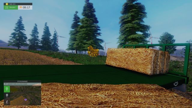 Aby rzucić belę na przyczepę wystarczy podejść odpowiednio blisko. - Uprzątnięcie pola (bele) | Praca na polu w Symulator Farmy 2015 - Symulator Farmy 2015 - poradnik do gry