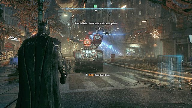 Skanuj kolejne części czołgu i dbaj o to żeby nie znaleźć się w jego polu rażenia - Zeskanowanie czołgu Kobra w celu identyfikacji jego słabych stron | Główny wątek fabularny - Batman Arkham Knight - poradnik do gry