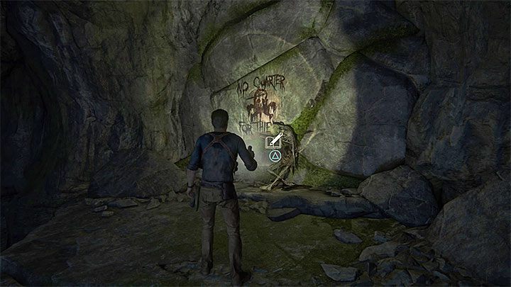 Zbadaj napis na ścianie i zjedź po stromym zboczu w jaskini - Uncharted 4 Kres Złodzieja: Rozdział 13 Rozbitkowie - solucja, opis przejścia - Uncharted 4: Kres Złodzieja - poradnik do gry