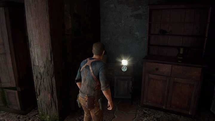 Gdy wraz ze swoją kompanią uciekniesz najemnikom - zejdź przez bramę, następnie schodami w dół - obejdź je i wejdź do budynku - Uncharted 4 Kres Złodzieja: W potrzasku - wszystkie skarby - Uncharted 4: Kres Złodzieja - poradnik do gry