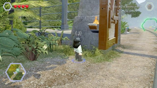 Drugi złoty klocek znajduje się nad bramą - Brama parku jurajskiego | Jurassic Park - sekrety - LEGO Jurassic World - poradnik gry