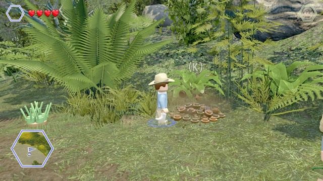 Podejdź jako Grant do kupki ziemi i wykop z niej niebieski klocek - Równiny Brachiozaurów | Jurassic Park - sekrety - LEGO Jurassic World - poradnik gry