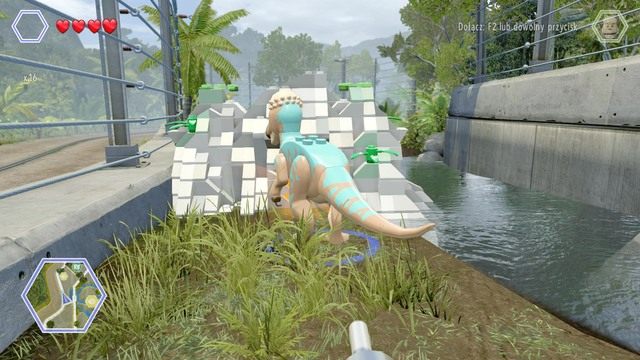 Przejdź na lewą stronę jako Pachycefalozaur i zniszcz widoczną na obrazku blokadę na drodze - Terytorium mięsożerców | Jurassic Park - sekrety - LEGO Jurassic World - poradnik gry