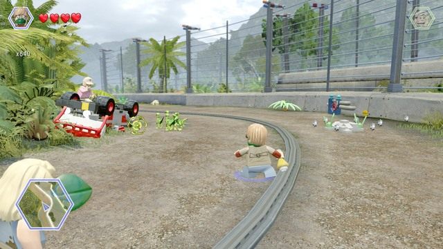 Podejdź jako Eric i przegoń kompsognaty rzucając w ich stronę zapach tyranozaura - Terytorium mięsożerców | Jurassic Park - sekrety - LEGO Jurassic World - poradnik gry