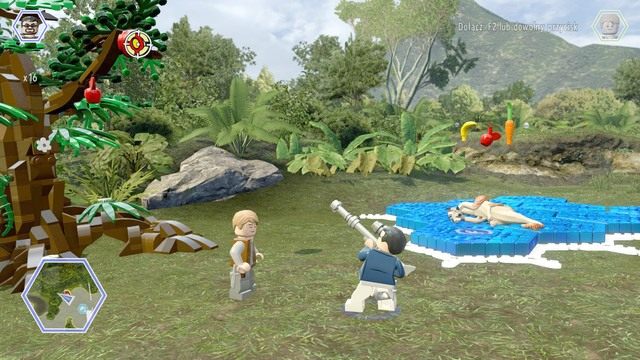 Postacią posiadającą broń, strzel w tarczę zawieszoną na drzewie - Dolina żyrosfer | Jurassic World - sekrety - LEGO Jurassic World - poradnik gry