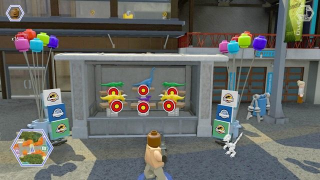Podejdź jako postać z bronią palną do stoiska i strzelaj w tarcze - Główna ulica | Jurassic World - sekrety - LEGO Jurassic World - poradnik gry