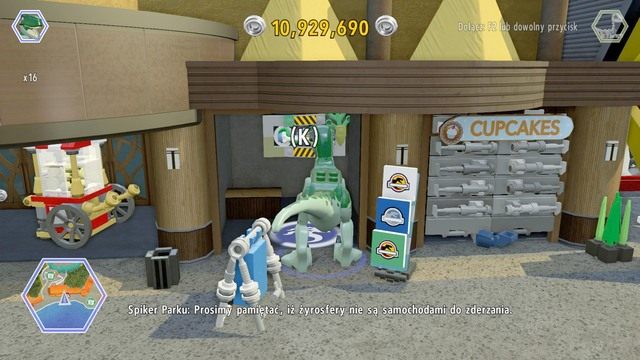 Podejdź jako raptor do widocznego drążka i użyj go by podnieść roletę, która przygniotła pracownika - Główna ulica | Jurassic World - sekrety - LEGO Jurassic World - poradnik gry