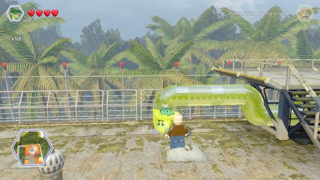Po ukończeniu wyścigu, zmień postać na kompsognata i wejdź do rury - Centrum komunikacyjne | Jurassic Park The Lost World - sekrety - LEGO Jurassic World - poradnik gry