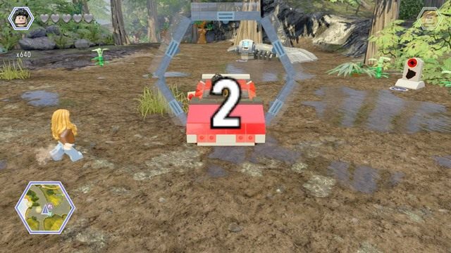 Używając samochodu, ustaw się na linię startu i ukończ wyścig w wymaganym czasie - Mobilne laboratorium | Jurassic Park The Lost World - sekrety - LEGO Jurassic World - poradnik gry