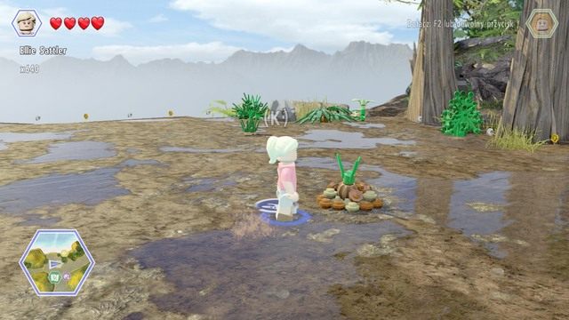 Podejdź jako Ellie do kupki ziemi i podlej ją - Mobilne laboratorium | Jurassic Park The Lost World - sekrety - LEGO Jurassic World - poradnik gry