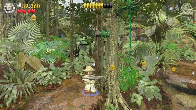 Zmień postać na Roberta i strzel w kolejną tarczę, której zaczep blokuje lianę - Przywracanie zasilania | Jurasic Park - opis przejścia - LEGO Jurassic World - poradnik gry