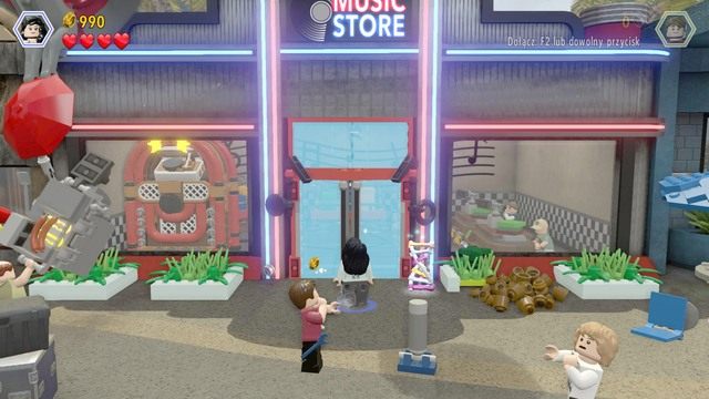 Zacznij kontrolować postać Zary i podejdź do szklanych drzwi po czym stłucz je umiejętnością specjalną - Atak | Jurassic World - opis przejścia - LEGO Jurassic World - poradnik gry