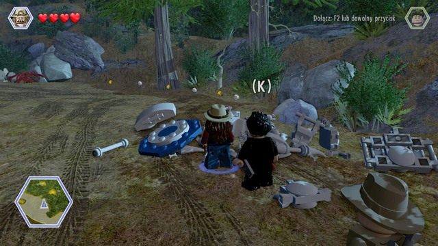 Po oddaniu banana, podejdź dowolną postacią do szkieletu obok jaskini i zniszcz go - Zwierzyna | Jurassic Park The Lost World - opis przejścia - LEGO Jurassic World - poradnik gry