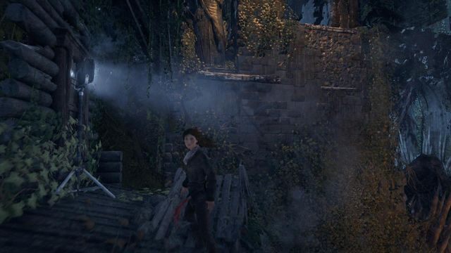 Na końcu wioski, z budynku bronionego przez strażników przedostaniesz się za mur - Rise of the Tomb Raider: Przejdź przez okupowaną wioskę, aby dotrzeć do klasztoru - Rise of the Tomb Raider - poradnik do gry