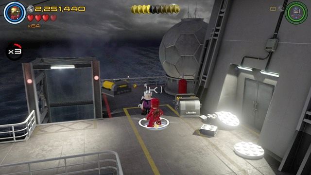 Na drugim piętrze statku znajdziesz kolekcjonera, u którego musisz wziąć zadanie - Stan Lee / Czerwony klocek | Wizja do rewizji - sekrety | LEGO Marvels Avengers - LEGO Marvels Avengers - poradnik do gry