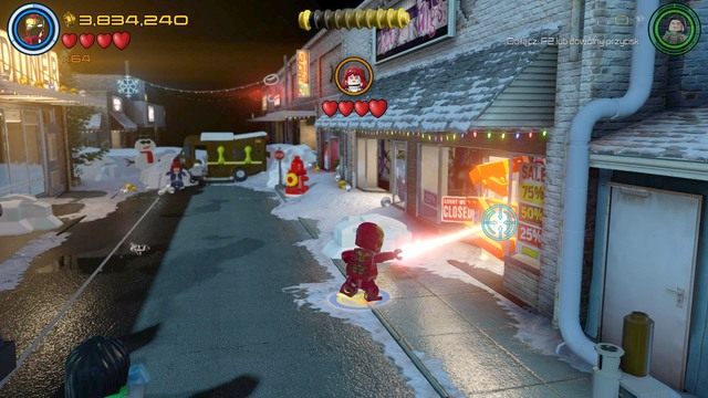 Po przejściu przez blokadę, przed walką z bossem, podejdź do prawej strony i zniszcz widoczną na obrazku złotą barykadę za pomocą lasera Iron Mana - Postacie | A.I.M. nic się nie IMA - sekrety | LEGO Marvels Avengers - LEGO Marvels Avengers - poradnik do gry