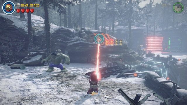 Jako Iron Man podejdź do widocznego na obrazku miejsca i wyceluj w złote łańcuchy blokujące pnie za pomocą lasera - Konstruktywna DeStrukcja | Opis przejścia | LEGO Marvels Avengers - LEGO Marvels Avengers - poradnik do gry