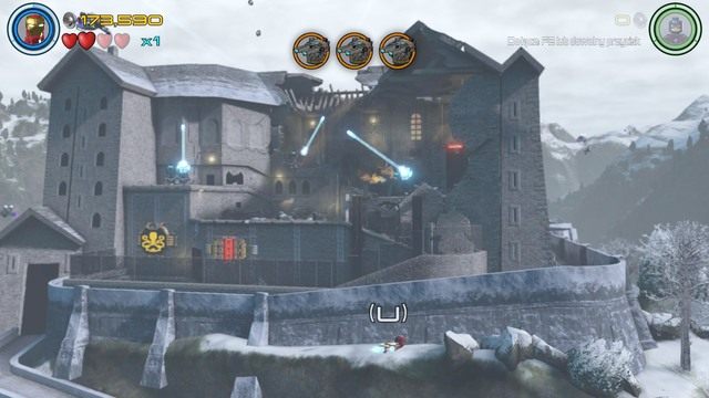 W momencie kiedy dostaniesz się do fortecy, zmień postać na latającego wokół niej Iron Mana i zniszcz dziewięciu wrogów - Konstruktywna DeStrukcja | Opis przejścia | LEGO Marvels Avengers - LEGO Marvels Avengers - poradnik do gry