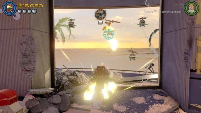 Po otwarciu drzwi podejdź do zniszczonej maszyny jako Stark i napraw ją po czym ze szczątków helikoptera zbuduj działo - A.I.M. nic się nie IMA | Opis przejścia | LEGO Marvels Avengers - LEGO Marvels Avengers - poradnik do gry