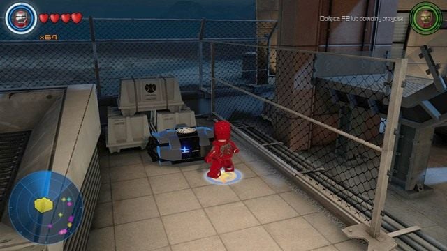 Po lewej stronie placówki znajdziesz czarny pojemnik - Złote klocki | Baza S.H.I.E.L.D. - sekrety | LEGO Marvels Avengers - LEGO Marvels Avengers - poradnik do gry