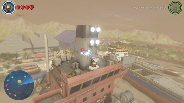 Żeby otworzyć widoczny na obrazku pojemnik zawierający złoty klocek musisz zapalić cztery lampy znajdujące się nad nim - Złote klocki | Południowa Afryka - sekrety | LEGO Marvels Avengers - LEGO Marvels Avengers - poradnik do gry