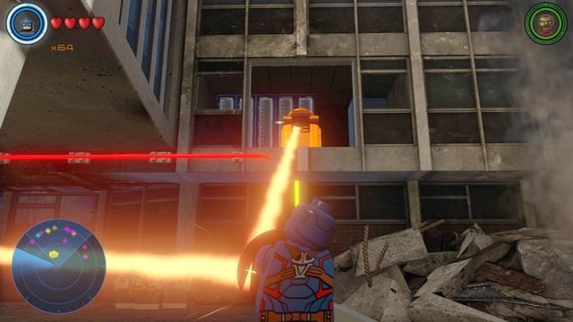 Korzystając z Kapitana Ameryki, wejdź na platformę i odbij bieg lasera, w pokazany na obrazku złoty pojemnik - Złote klocki | Sokovia - sekrety | LEGO Marvels Avengers - LEGO Marvels Avengers - poradnik do gry