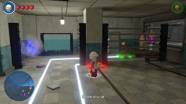 Po opuszczeniu dźwigni otworzą się kolejne kraty, po lewej stronie od postaci drugiej - Złote klocki | Sokovia - sekrety | LEGO Marvels Avengers - LEGO Marvels Avengers - poradnik do gry