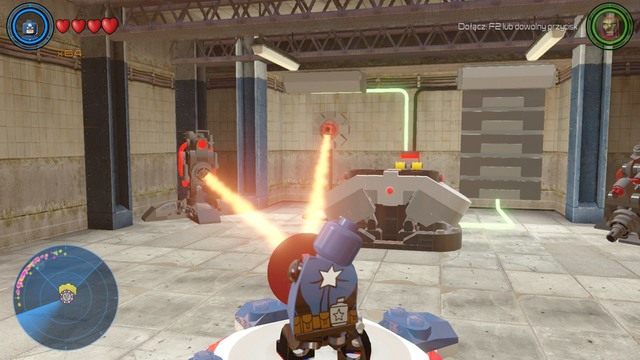 Po przedostaniu się do środka, pociągnij za dźwignię znajdującą się za pojemnikiem i ustaw Kapitana Amerykę na platformie - Złote klocki | Północny Manhattan - sekrety | LEGO Marvels Avengers - LEGO Marvels Avengers - poradnik do gry