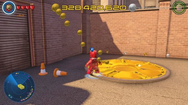 Niedaleko piętrowego parkingu znajdziesz pokazaną na obrazku złotą osłonę - Złote klocki | Południowy Manhattan - sekrety | LEGO Marvels Avengers - LEGO Marvels Avengers - poradnik do gry