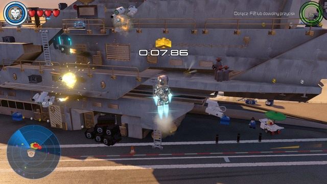 Zniszcz jako Iron Man pięć kamer w wymaganym czasie by uzyskać dostęp do kolejnego złotego klocka - Złote klocki | Helicarrier S.H.I.E.L.D. - sekrety | LEGO Marvels Avengers - LEGO Marvels Avengers - poradnik do gry