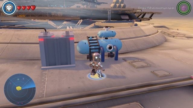 Po lewej stronie Hellicarriera znajdziesz niebieski obiekt z klocków, który musisz zniszczyć - Złote klocki | Helicarrier S.H.I.E.L.D. - sekrety | LEGO Marvels Avengers - LEGO Marvels Avengers - poradnik do gry