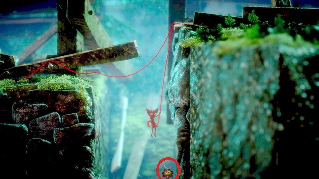 W dziurze, która zostanie zamknięta po odblokowywaniu mechanizmu znajduje się guzik - Poziom 5 - Off the Rails | Sekrety w Unravel - guziki - Unravel - poradnik do gry