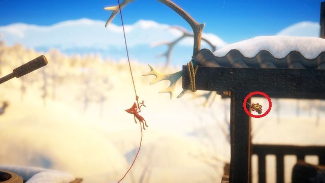 Jeden z guzików znajdziesz pod porożem - zrób pętlę, używając lassa zabraknie ci linki - Poziom 9 - Winter Sun | Sekrety w Unravel - guziki - Unravel - poradnik do gry