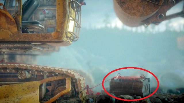 Teraz, przepchnij drewnianą skrzynkę pod koparkę i z trampoliny na niej utworzonej wyskocz do góry i przedostań się aż na dach pojazdu - Poziom 6 - Down in a Hole | Opis przejścia Unravel - Unravel - poradnik do gry