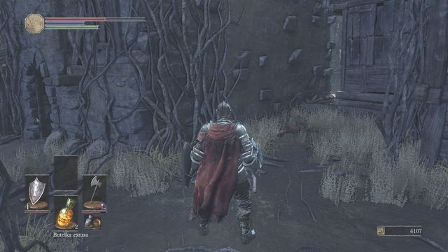 Zaraz po opuszczeniu budynku odbij lekko w prawo i zniszcz przeszkody (screen) - Osada Nieumarłych - od dużego placu, droga na wprost | Opis przejścia - Dark Souls III - opis przejścia i sekrety