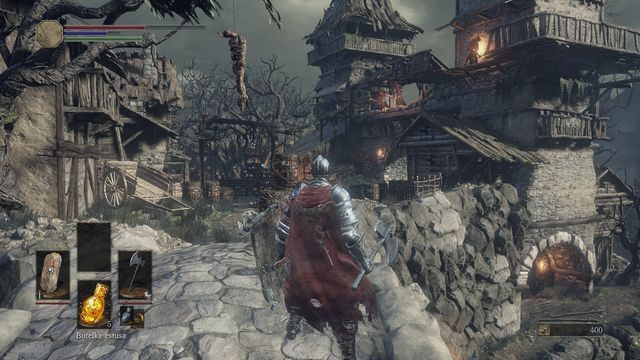 Zaraz za nimi z prawej strony znajdziesz Okrągłą tarczę kaduceusza - Osada Nieumarłych - od dużego placu, droga w prawo przez most | Opis przejścia - Dark Souls III - opis przejścia i sekrety