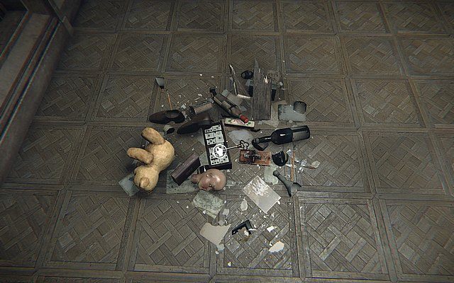 Wejdź przez drzwi - na podłodze ujrzysz stertę śmieci - Krok 5 - Dotyk | Opis przejścia Layers of Fear - Layers of Fear - poradnik do gry