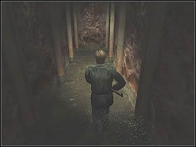 Na miejscu znajdziesz dużą rzeźbę przedstawiającą twarze o różnych kolorach oczu - Katakumby - Część 1 | Silent Hill 2 - Silent Hill 2 - poradnik do gry