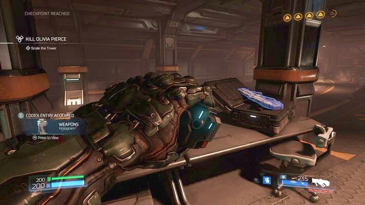 Gdy znajdziesz się już na górze, wejdź po schodach do pomieszczenia ze stacją zdrowia oraz Hologramem - Wieża Energii Argentu | Opis przejścia | Doom - Doom - poradnik do gry