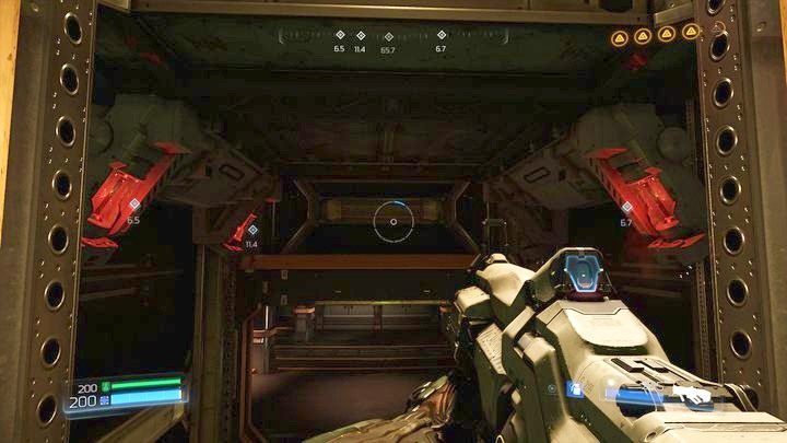 Gdy znowu dojdziesz do szybu, wskocz na platformę u góry, a następnie odwróć się i strzel w cztery czerwone hamulce blokując windę - Wieża Energii Argentu | Opis przejścia | Doom - Doom - poradnik do gry