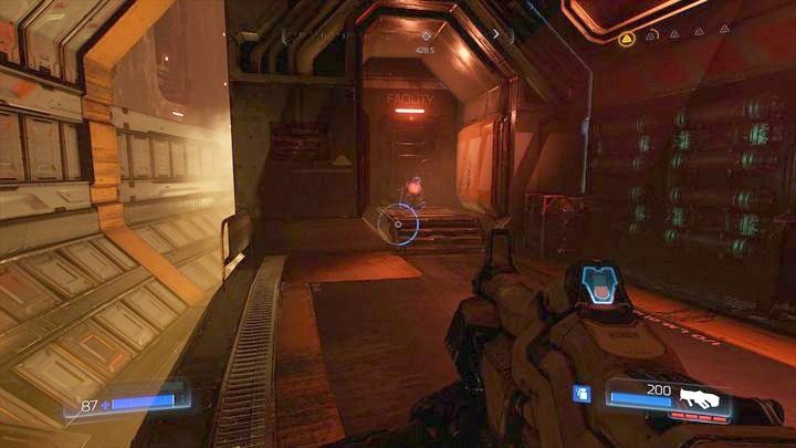 W pewnym momencie dojdziesz do pomieszczenia z przesuwającymi się kontenerami - Wieża Energii Argentu | Sekrety | Doom - Doom - poradnik do gry