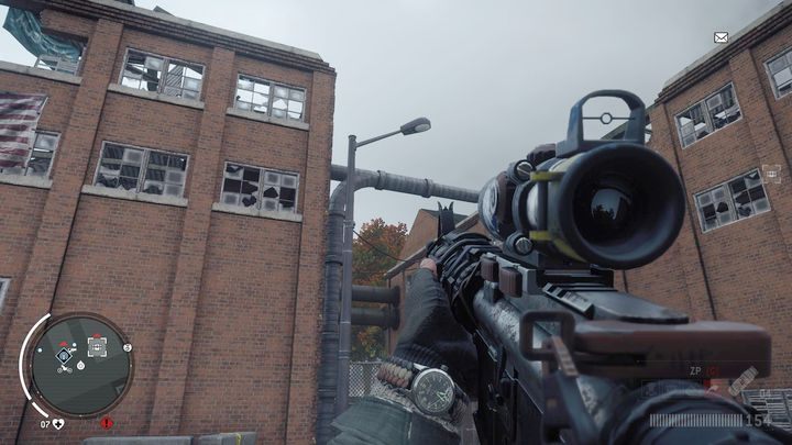 Wejście do magazynu jedenastego znajdziesz w lewym budynku pokazanym na obrazku - Czerwona strefa Elmtree | Magazyny i zlecenia - Homefront: The Revolution - poradnik do gry