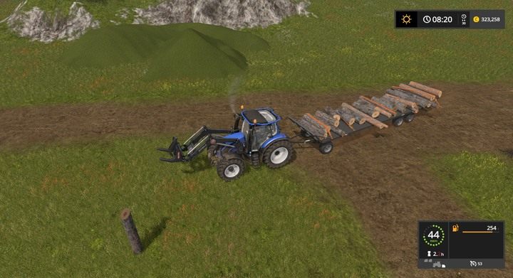 Naczepa pełna ładowanych rękoma belek - mimo że pasy są prostopadle, wszystko trzyma się jak należy - Bele i kłody w Farming Simulator 17 | Podstawy leśnictwa - Farming Simulator 17 - poradnik do gry