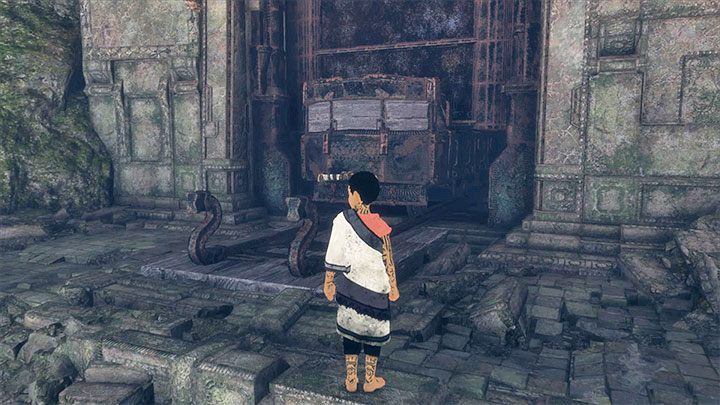 Wybierz małe przejście pod częściowo podniesioną bramą - Nakarmienie Trico i przejście przez ciemny tunel | The Last Guardian - The Last Guardian - poradnik do gry