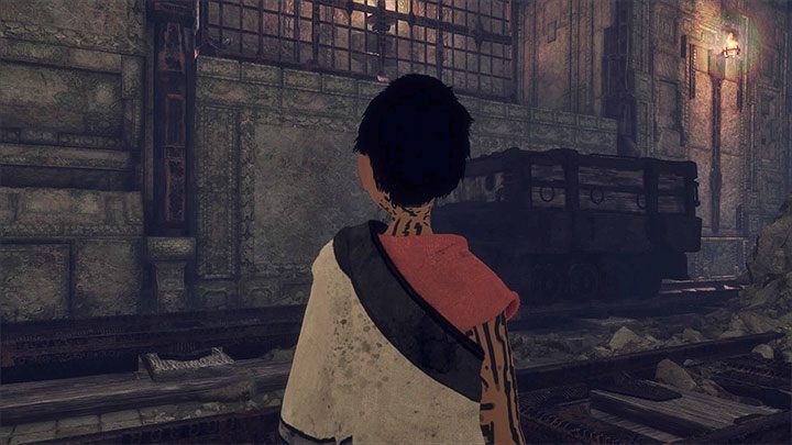 Wagon powinien zatrzymać się w miejscu pokazanym na powyższym obrazku - Nakarmienie Trico i przejście przez ciemny tunel | The Last Guardian - The Last Guardian - poradnik do gry