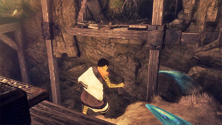 Wejdź do lewego tunelu, przejdź na sam jego koniec, odwróć się i przywołaj do siebie Trico (obrazek 1) - Przejście przez kopalnię - The Last Guardian - poradnik do gry